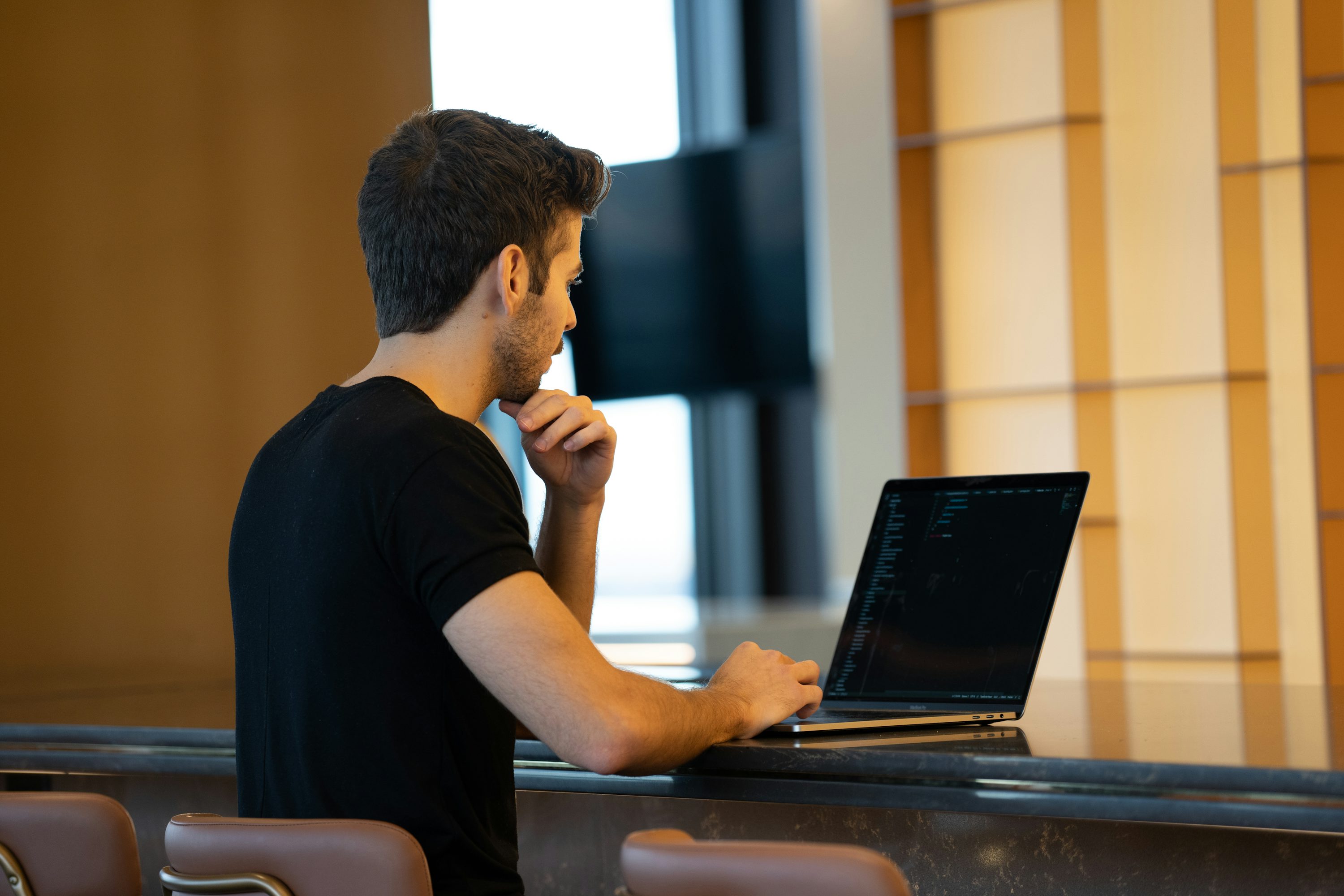 Man sitting at laptop computer